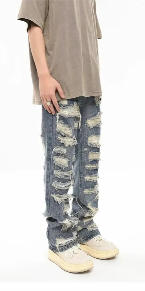 Jeans With Ripped Design